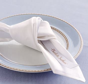 A White Napkin On Top Of A Blue Plate