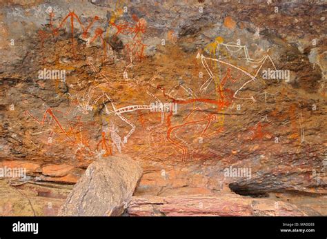 Aboriginal Rock Art Of People Dancing At Kakadu National Park Northern