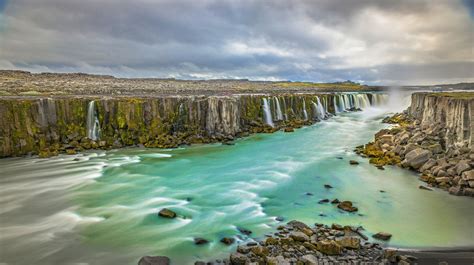 Its incredible, unimaginable landscape is characterised by unearthly colours, steaming geothermal activity, hot springs and water fountains. nature, Landscape, Waterfall, Iceland, Canyon, Clouds ...