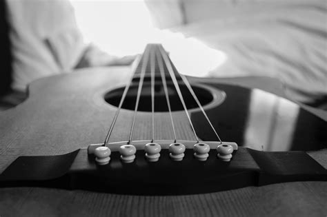 Wooden Acoustic Guitar Macro Photography In Grayscale Photo · Free