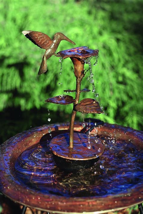 A hummingbird makes use of a bird bath. Hummingbird Solid Copper Dripper Fountain - Happy Gardens ...
