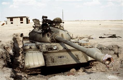 A Destroyed Iraqi T 55 Main Battle Tank Stands In The Sand At Jalibah Airfield Following The