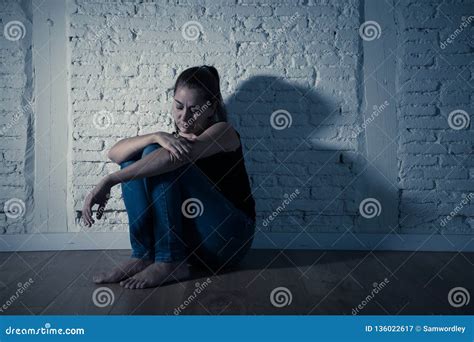 Sad Lonely Woman Suffering From Depression Sitting Alone And Hopeless