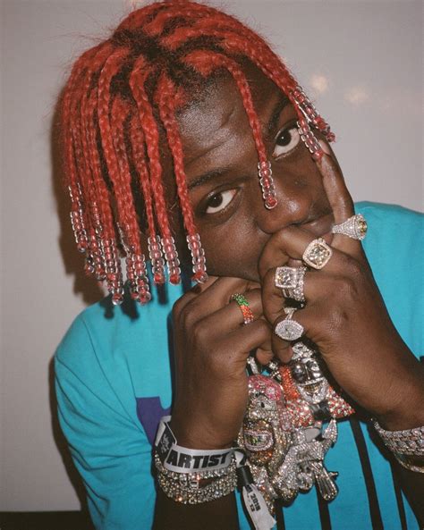 This red is bold and definitely makes a statement. The Outrageously Cool Lil Yachty Red Braids - Men's Hairstyles
