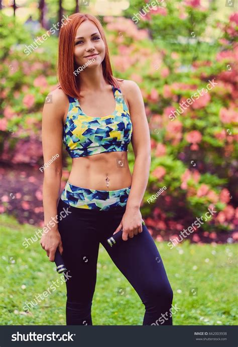 redhead female doing yoga in a summer park ad affiliate female redhead yoga park icon