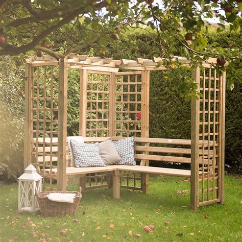A Beautiful Corner Arbour That Combines Simple Trellis And Benches To