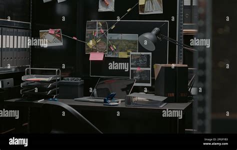 Evidence room office with detective board and desk, crime scene photos