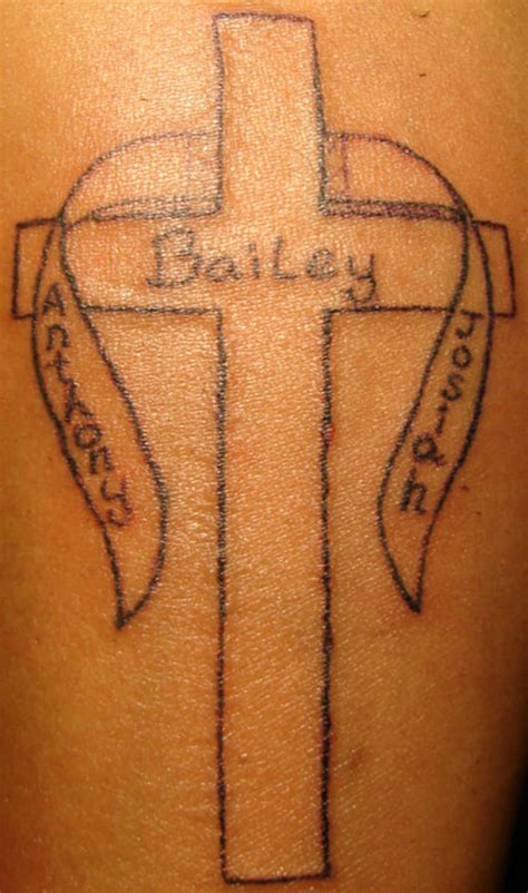 Cross Outline With Bannerboy Names Tattoo Pictures At