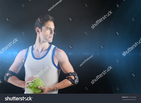 Confident Athlete Man Holding Ball Against Stock Photo 437142043