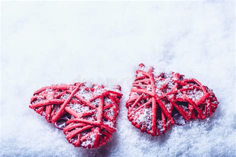 Two Beautiful Romantic Vintage Red Hearts Together On A White Snow