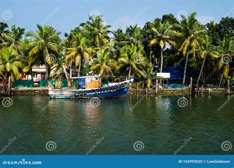 Ocean Fishing Boat Along The Canal Kerala Backwaters Shore With Palm
