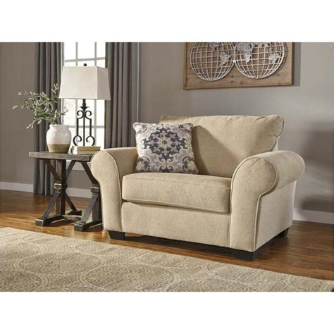 With oversized and padded arms, a spacious seat and a beautiful line of brushed platinum at the base, the laguna ridge chair and a half brings elegance to any home. 8490423 Ashley Furniture Denitasse Living Room Chair And A Half