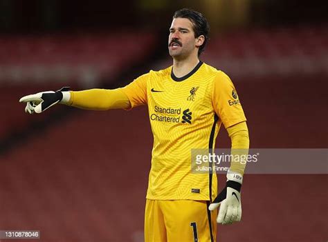 Alisson Becker Goalkeeper Of Liverpool Looks On During The Premier