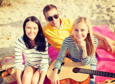 Group Of Friends With Guitar Having Fun On Beach Stock Image Image Of