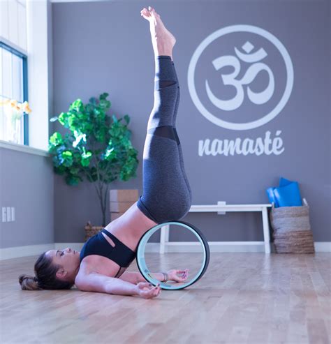 3 Ways To Use A Yoga Wheel — Yogabycandace
