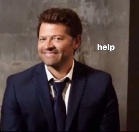 A Man In A Suit And Tie Smiling At The Camera With Words That Say Help