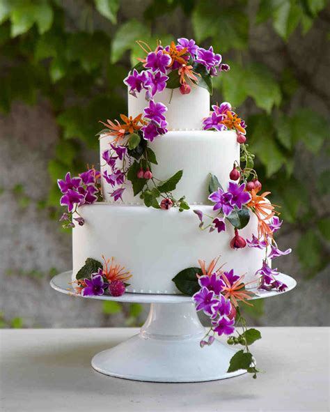 Take your layered wedding cake to the next level by choosing a gorgeous array of flowers and placing them in a cascading manner down the front of it. 25 Amazing Beach Wedding Cakes | Martha Stewart Weddings
