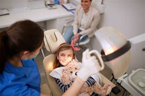Top View Of Child In Dental Chair Stock Photo Image Of Explaining