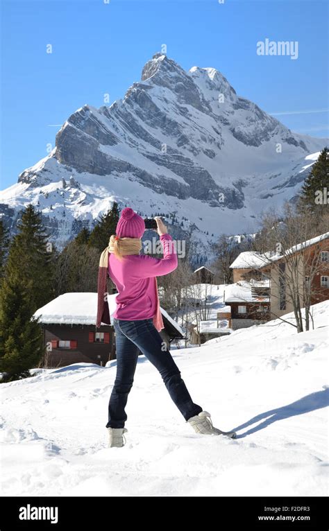 Girl Taking A Photo In The Swiss Alps Stock Photo Alamy