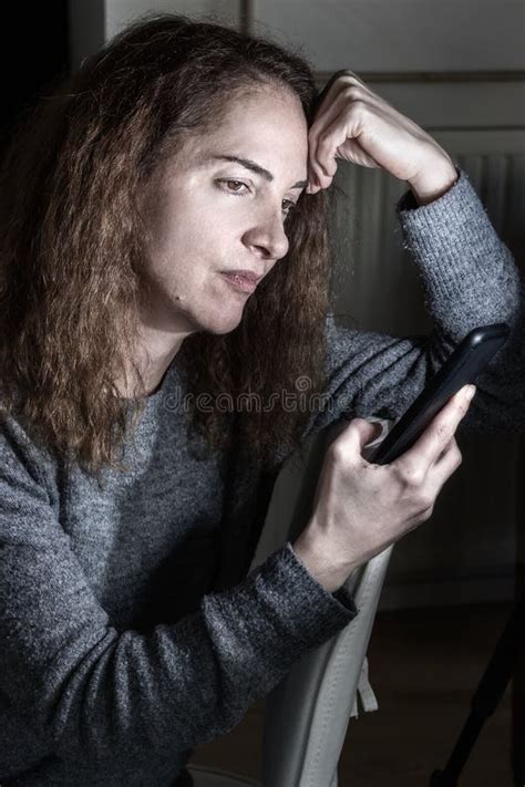 Portrait Of Lonely Mature Woman With Worried Facial Expression Thinking