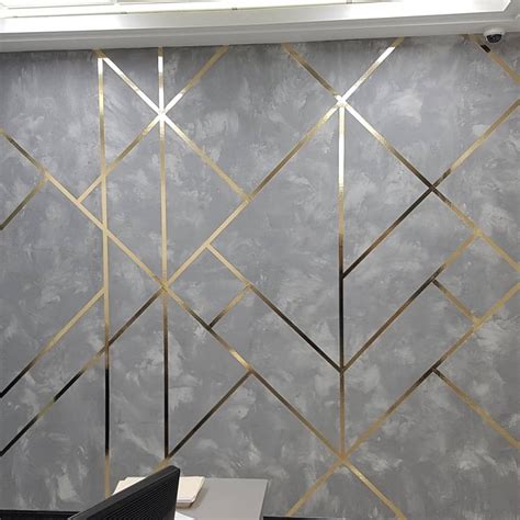 Concrete Textured Wall With Golden Geometrical Lines Wall Texture