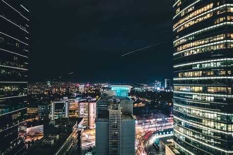 High Rise City Building During Night Time Photo · Free Stock Photo
