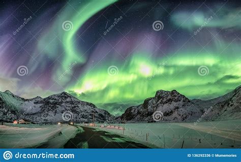 Aurora Borealis Northern Lights Over Snow Mountain Range