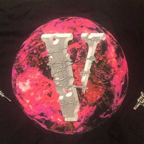 A T Shirt With The Letter V On It