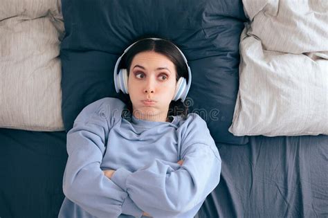 Stressed Woman Wearing Headphones Lying In Bed Stock Image Image Of