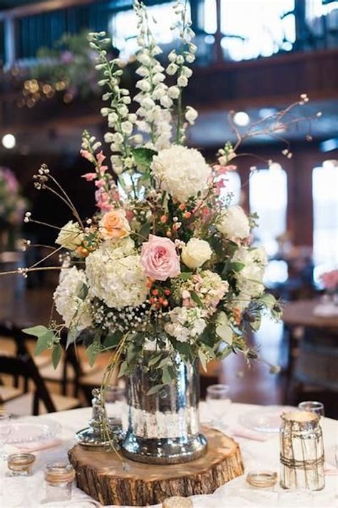 Gorgeous Floral Centerpiece On A Rustic Wood Slab