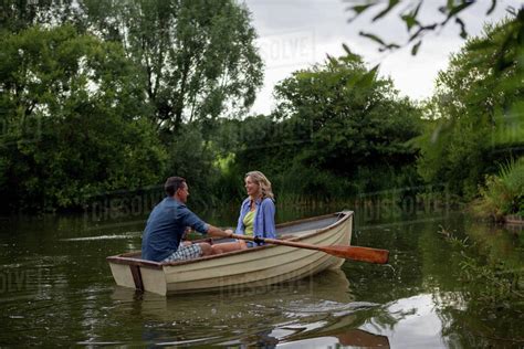 Mature Couple In Rowing Boat On Rural Lake Stock Photo Dissolve