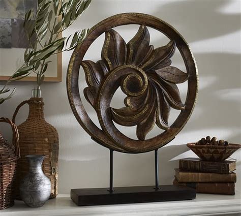 Our sword stand is a sturdy and attractive black lacquered wooden construction with a cold cast, colorful decorative medallion featuring crossed katanas. Carved Wood Medallion on Stand | Pottery Barn