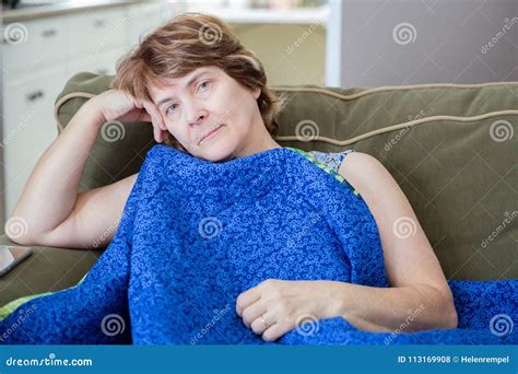 Head Shot Of Sad Caucasian Woman Resting Head In Hand Stock Photo