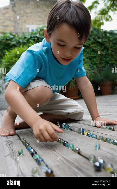 Child With Marbles Hi Res Stock Photography And Images Alamy