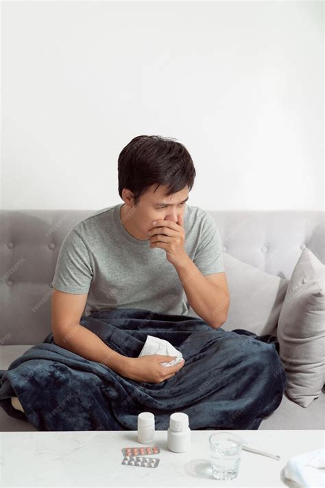 Premium Photo Sick Man Lying On Bed And Coughing A Lot