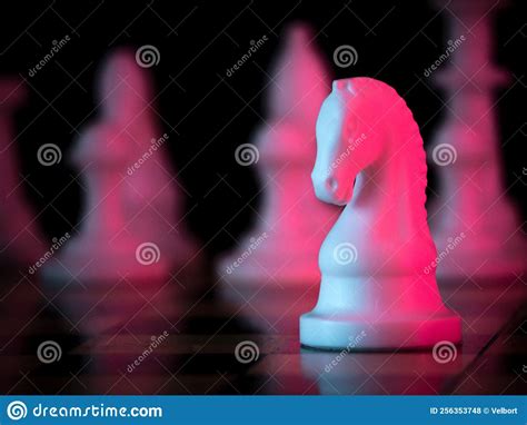 White Horse Chess Piece On A Chessboard Chess Match Bright Red Light