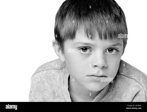 Black And White Photo Of A Young Boy Looking Sad Stock Photo Alamy