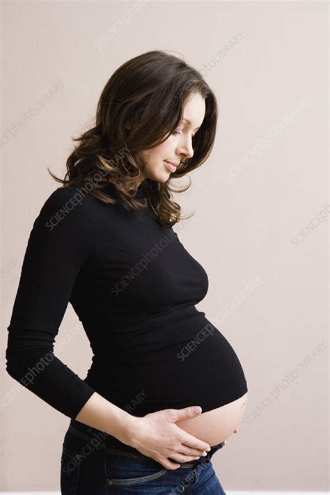 Pregnant Woman Holding Her Belly Stock Image F003 2190 Science Photo Library