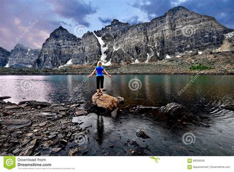 Valley Of Ten Peaks At Sunset And Woman Hiking Stock Photo Image Of
