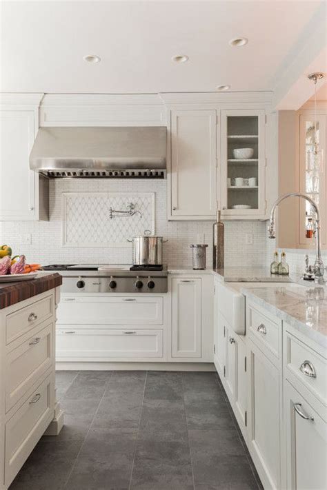 White kitchen cabinets are easily the most popular color choice, and there is something special about the color white. Creamy white cabinets paired with Supreme White Quartzite ...