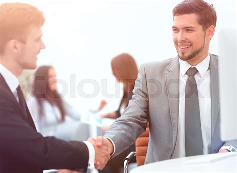 Handshake Manager And The Client In The Office Stock Image Colourbox