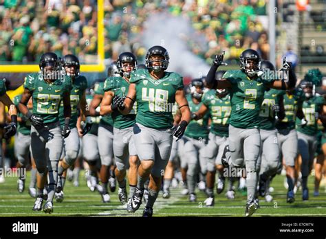The Oregon Ducks Run Onto The Field Before Kickoff The University Of