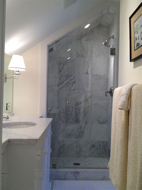 Bathroom remodel a shower curtains for a decorators dream with. Frameless glass door in marble shower with slanted ceiling ...