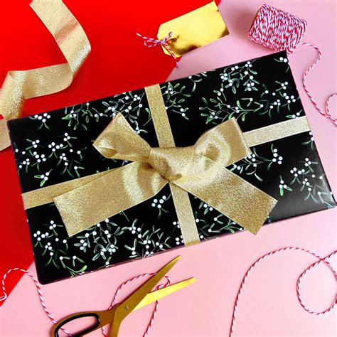 Try our glossy black wrapping paper (which will certainly make your present be the first to be looked at) or our matte black gift wrap for a recycled message. Luxury Black Mistletoe Christmas Wrapping Paper By ...