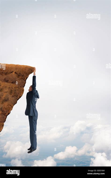 Man Hanging On Cliff Hi Res Stock Photography And Images Alamy