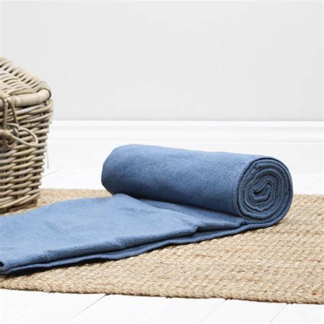 The blanket tote unfolds easily and refolds into a convenient carry tote featuring a closing flap complete with a zippered pocket, and an adjustable the flap is made of 600d polyester in navy blue. blue and navy fleece picnic blanket by marquis & dawe ...