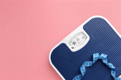Scales And Measuring Tape On Color Background Weight Loss Concept