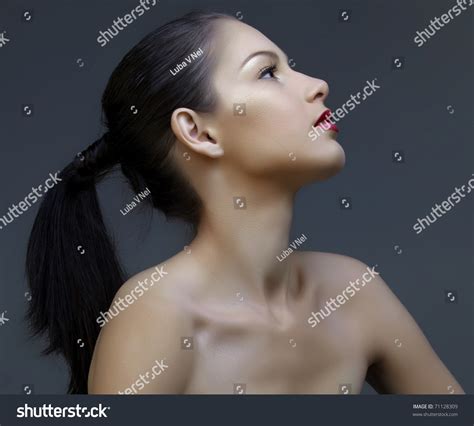 Beautiful Woman With Long Black Hair In Ponytail And Shiny