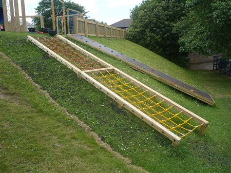 Playground On Top Of A Slope Climbing Wall And Embankment Net On Hill