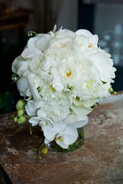 Teardrop Shape Wedding Bouquet Arranged With White Phalaenopsis